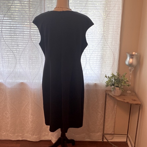 Black cocktail dress with cap sleeve and lace front panel. - Picture 3 of 9